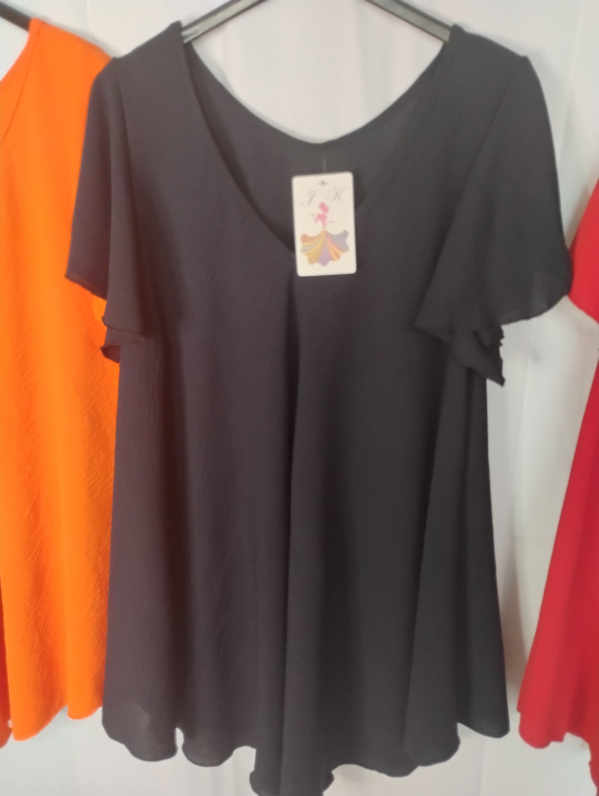 Blouse fluide · Col V · Coupe pyramide · 4 couleurs · TU46-52